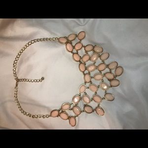 gold and pink necklace